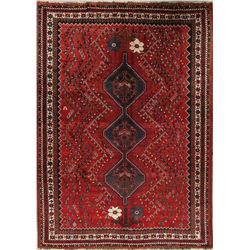 A WOOL HAND KNOTTED NOMADIC AREA RUG.