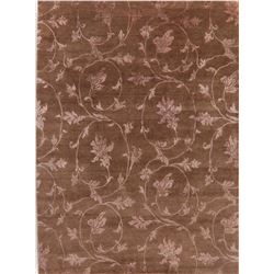 A WOOL HAND KNOTTED FLORAL AREA RUG.