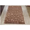 Image 2 : A WOOL HAND KNOTTED FLORAL AREA RUG.