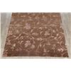 Image 5 : A WOOL HAND KNOTTED FLORAL AREA RUG.