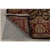 Image 10 : A WOOL HAND KNOTTED FLORAL AREA RUG.