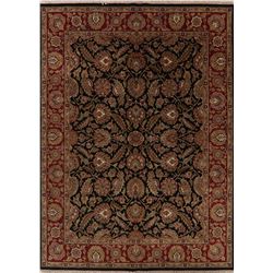 A WOOL HAND KNOTTED FLORAL AREA RUG.