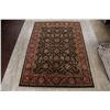 Image 2 : A WOOL HAND KNOTTED FLORAL AREA RUG.