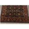 Image 5 : A WOOL HAND KNOTTED FLORAL AREA RUG.
