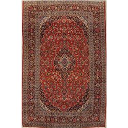 A WOOL HAND KNOTTED FLORAL ORIENTAL AREA RUG.