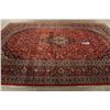 Image 9 : A WOOL HAND KNOTTED FLORAL ORIENTAL AREA RUG.