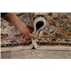 Image 12 : A WOOL HAND KNOTTED FLORAL MEDALLION AREA RUG.
