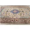 Image 9 : A WOOL HAND KNOTTED FLORAL MEDALLION AREA RUG.