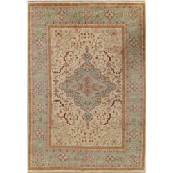 A WOOL HAND KNOTTED HERIZ AREA RUG.