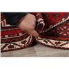 Image 12 : A WOOL HAND KNOTTED LORI AREA RUG.
