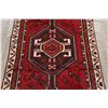 Image 3 : A WOOL HAND KNOTTED LORI AREA RUG.