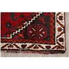 Image 6 : A WOOL HAND KNOTTED LORI AREA RUG.
