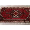 Image 9 : A WOOL HAND KNOTTED LORI AREA RUG.