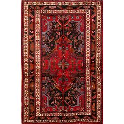 A WOOL HAND KNOTTED ORIENTAL AREA RUG.