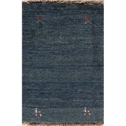 A WOOL HAND KNOTTED GABBEH AREA RUG.