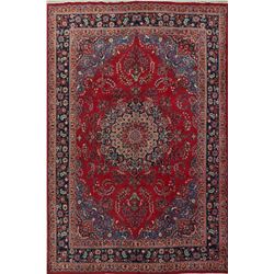 A WOOL HAND KNOTTED FLORAL ORIENTAL AREA RUG.