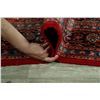Image 12 : A WOOL HAND KNOTTED FLORAL MEDALLION AREA RUG.