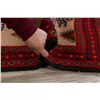 Image 11 : A WOOL HAND KNOTTED BALOUCH AREA RUG.