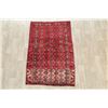 Image 2 : A WOOL HAND KNOTTED BALOUCH ORIENTAL AREA RUG.