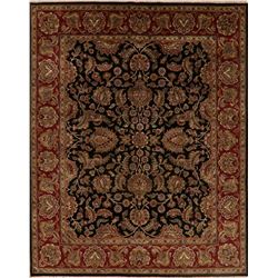 A WOOL HAND KNOTTED FLORAL ORIENTAL AREA RUG.
