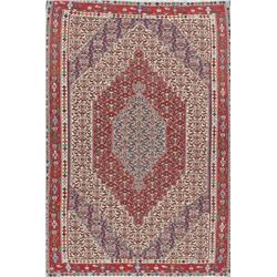 A WOVEN HAND KNOTTED MEDALLION KILIM.