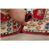 Image 11 : A WOOL HAND KNOTTED KAZAK ORIENTAL RUG.
