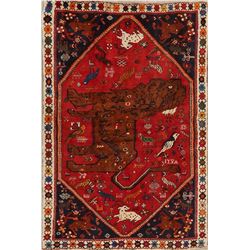 A WOOL HAND KNOTTED PICTORIAL AREA RUG.