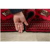 Image 12 : A WOOL HAND KNOTTED BALOUCH ORIENTAL AREA RUG.
