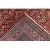 Image 10 : A WOOL HAND KNOTTED MEDALLION AREA RUG.