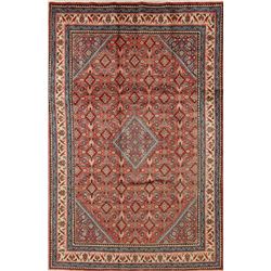 A WOOL HAND KNOTTED MEDALLION AREA RUG.
