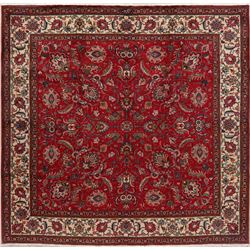 A WOOL HAND KNOTTED FLORAL ORIENTAL AREA RUG.