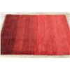Image 9 : A WOOL HAND KNOTTED GABBEH AREA RUG.