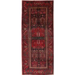 A WOOL HAND KNOTTED BJDJAR ORIENTAL RUG RUNNER.