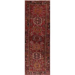A WOOL HAND KNOTTED GHARAJEH ORIENTAL RUG RUNNER.