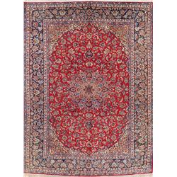 A WOOL HAND KNOTTED FLORAL ORIENTAL AREA RUG.