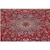 Image 4 : A WOOL HAND KNOTTED FLORAL ORIENTAL AREA RUG.