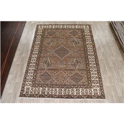 A WOOL HAND KNOTTED ORIENTAL AREA RUG.