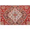 Image 10 : A WOOL HAND KNOTTED FLORAL AREA RUG.
