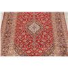 Image 3 : A WOOL HAND KNOTTED FLORAL AREA RUG.
