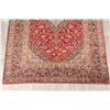 Image 4 : A WOOL HAND KNOTTED FLORAL AREA RUG.