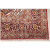 Image 5 : A WOOL HAND KNOTTED FLORAL AREA RUG.