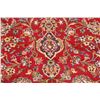 Image 6 : A WOOL HAND KNOTTED FLORAL AREA RUG.