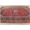 Image 9 : A WOOL HAND KNOTTED FLORAL ORIENTAL AREA RUG.