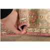 Image 12 : A WOOL HAND KNOTTED TURKISH AREA RUG.
