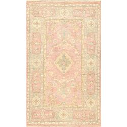 A WOOL HAND KNOTTED TURKISH AREA RUG.