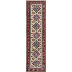 A WOOL HAND KNOTTED KAZAK ORIENTAL RUG RUNNER.