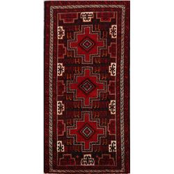 A WOOL HAND KNOTTED BALOUCH ORIENTAL RUG.