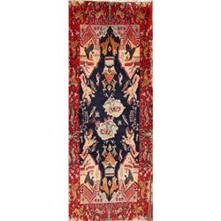 A WOOL HAND KNOTTED PICTORIAL RUG RUNNER.
