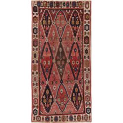 A WOOL HAND KNOTTED MOROCCAN AREA RUG.