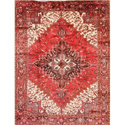 A WOOL HAND KNOTTED ORIENTAL AREA RUG.